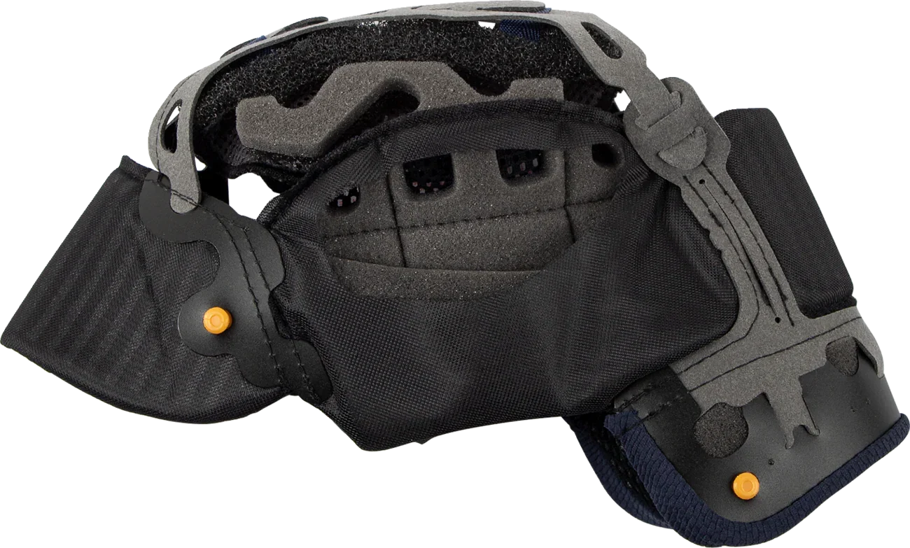 Black motorcycle helmet interior with padding, ventilation, and orange adjustment buttons for comfort and fit.