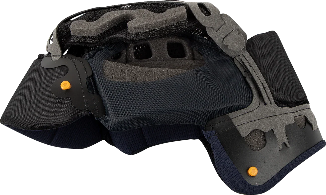 Black motorcycle helmet interior with foam padding and orange adjustment knobs for comfort and fit