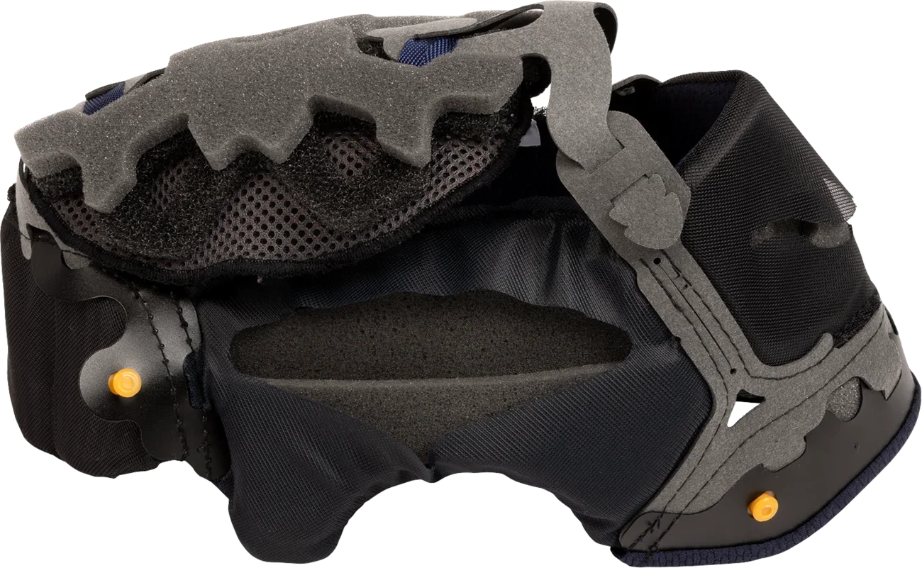 Black motorcycle helmet interior with gray foam padding and mesh lining for comfort and ventilation