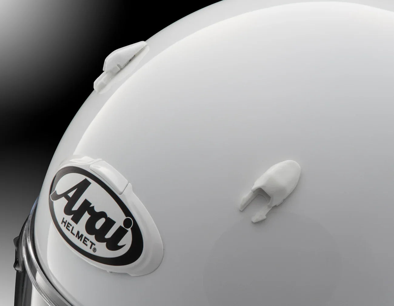 White Arai motorcycle helmet with logo and vent details