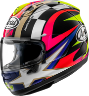 Arai motorcycle helmet with vibrant checkered and star design, featuring clear visor and bold colors