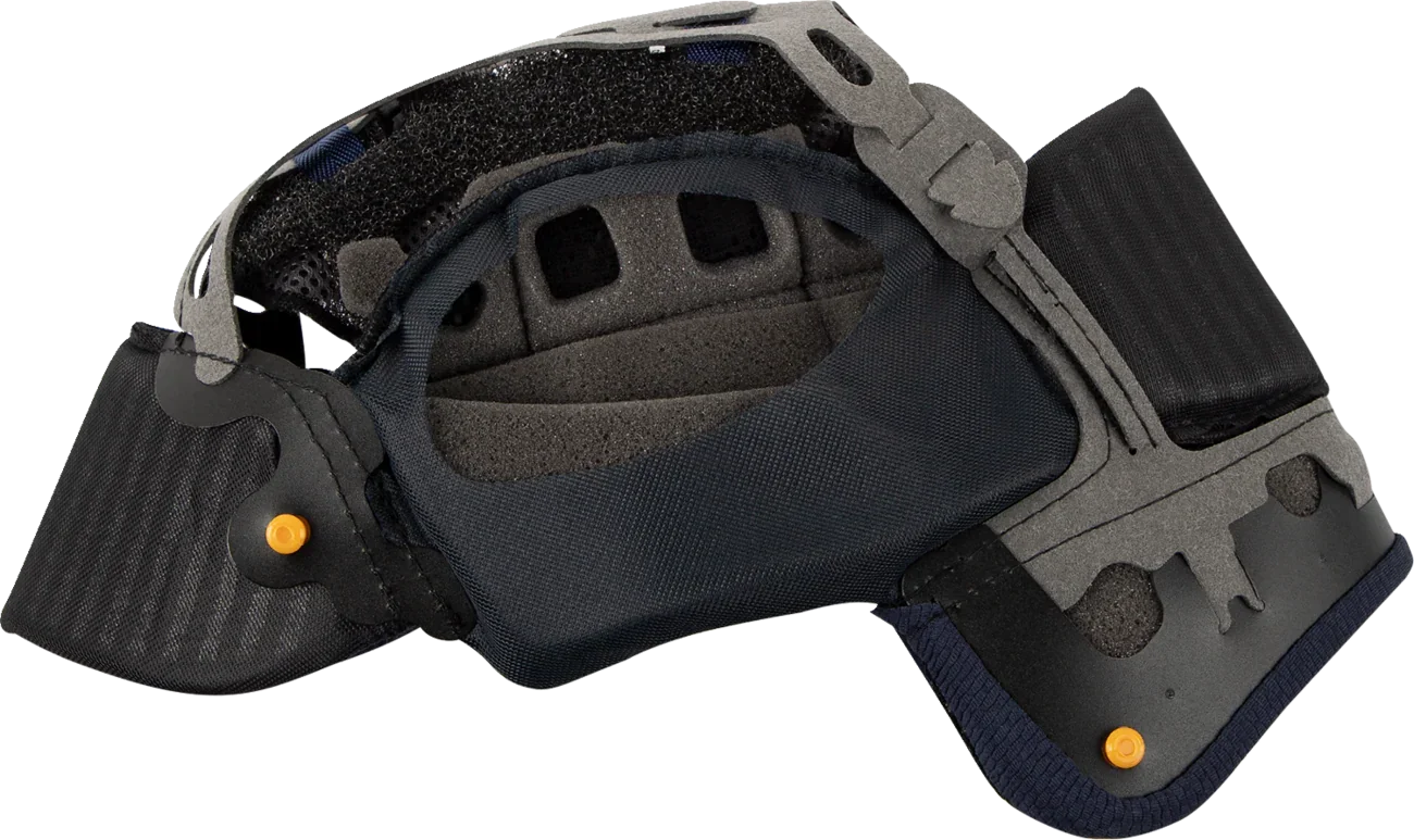 Motorcycle helmet interior with black padding, gray foam, and orange adjustment pins for comfort and fit