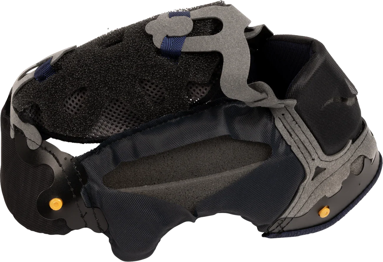 Black motorcycle helmet interior with padded lining, ventilation holes, and adjustable straps for comfort and safety