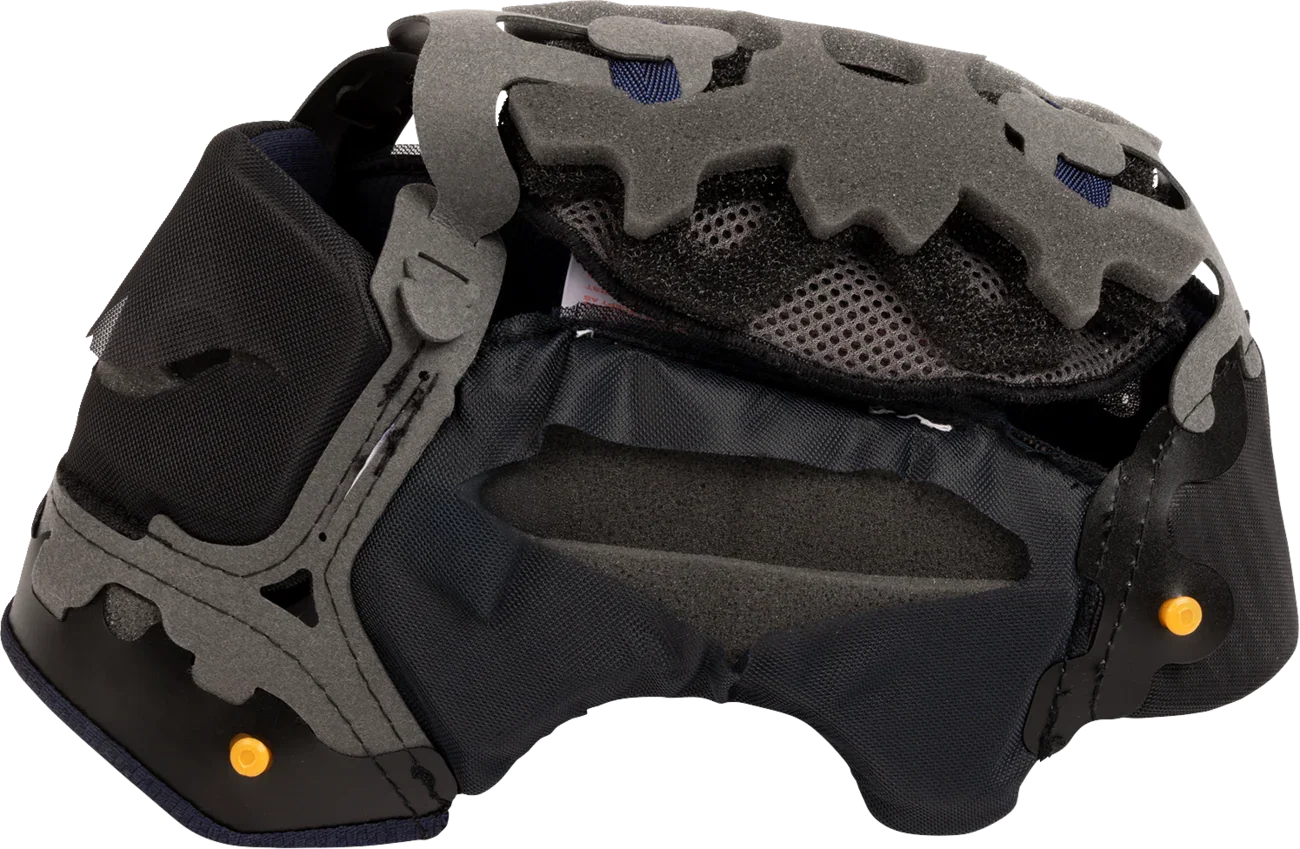 Motorcycle helmet interior with gray foam padding, black mesh lining, and orange adjustment knobs for comfort and fit.