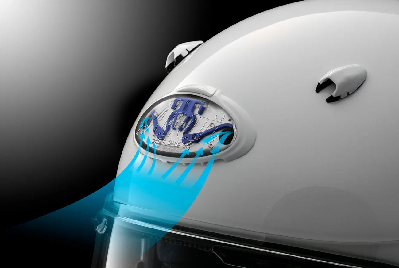White motorcycle helmet with airflow ventilation system and clear visor for cooling comfort